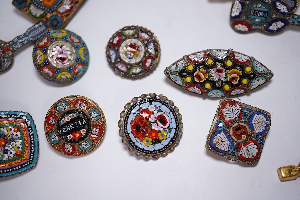 A collection of twenty-eight micro-mosaic brooches, including ten banjo and guitars shaped brooches, six similar large oval brooches, nine small brooches and three long brooches. (28) Condition - good